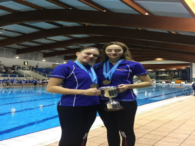 Greta and Daniella with centenary trophy and overall medals.png