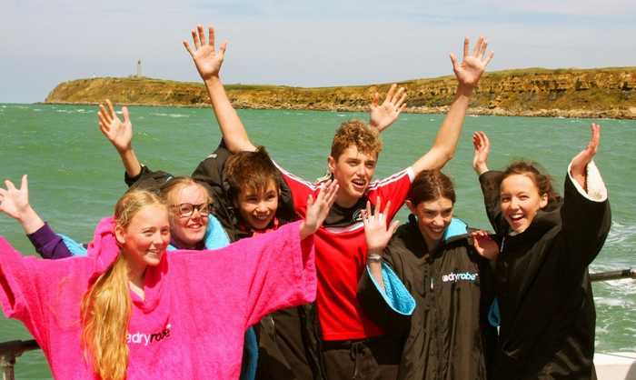Triumphant Team on the Stern of Pathfinder off of the French Coast